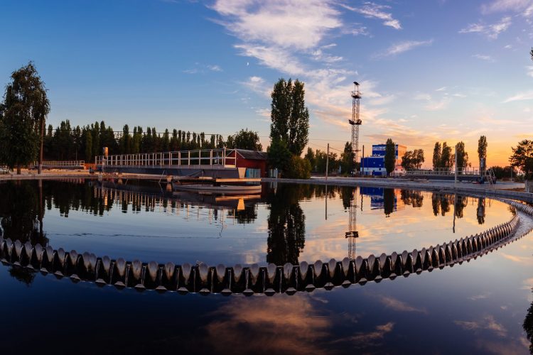 Modern wastewater treatment plant. Tanks for aeration and biological purification of sewage at sunset.